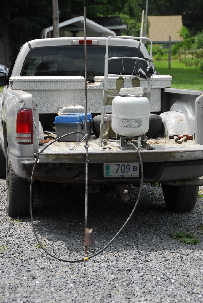Garden tools and landscaping equipment organized in truck bed